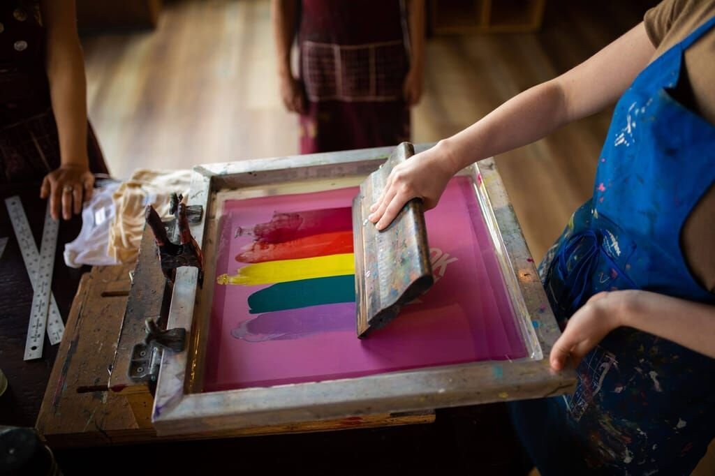 Screen printing custom t-shirts at The Merch House studio
