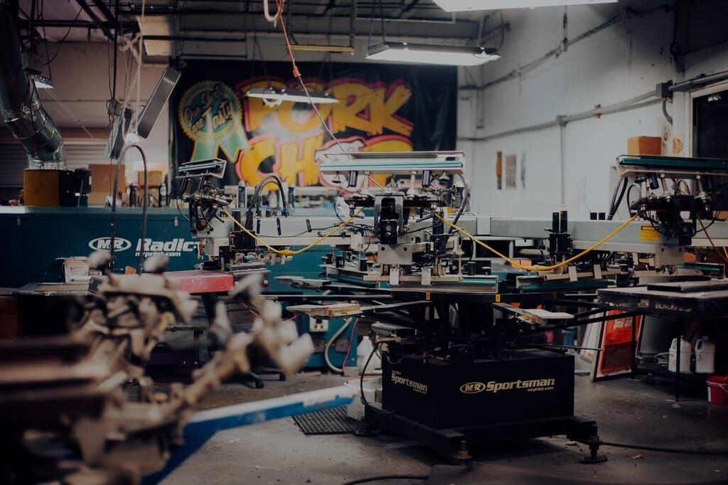 Folding and packaging freshly printed t-shirts in the production facility